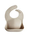 Mushie Silicone Baby Bib (Shifting Sand)